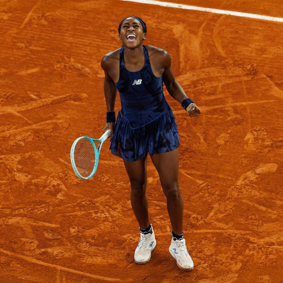 Young tennis athlete yelling for joy on the court. 
